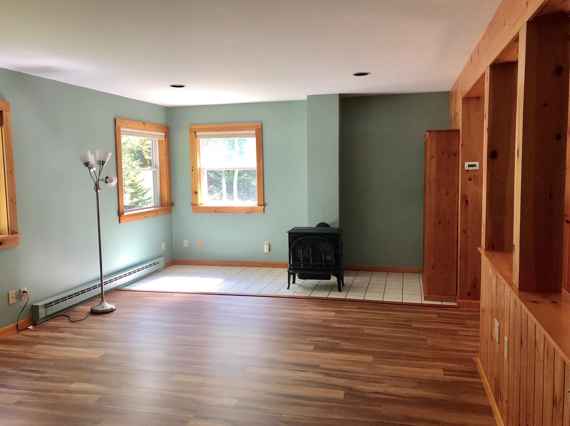 24 Ledges Road Bass Harbor, ME 04653 - Photo 27 of 61 Living room with propane heat stove