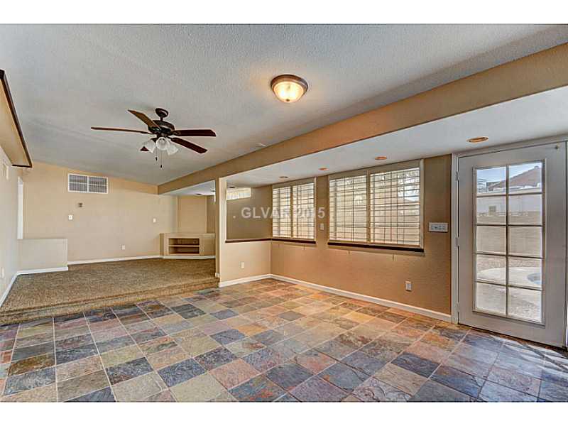 416 Blackridge Road Henderson, NV 89015 - Photo 16 of 35 Property Photo. Sun Room other side where the lounge area with entertainment center built in.