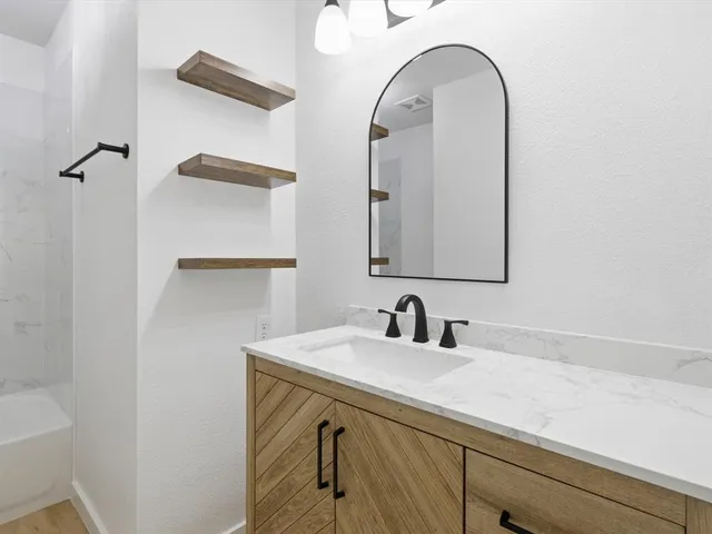a kitchen with a sink stove and microwave