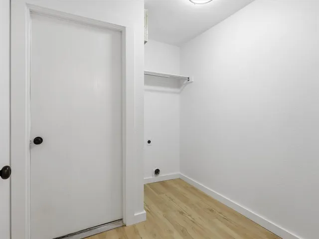 a bathroom with a bathtub shower sink vanity and toilet
