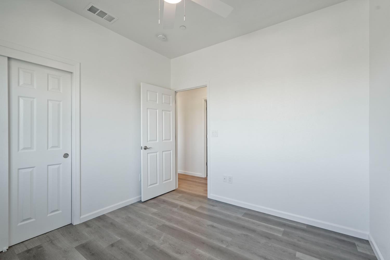 3286 Botfuher Road Valley Springs, CA 95252 - Photo 13 of 24 an empty room with wooden floor
