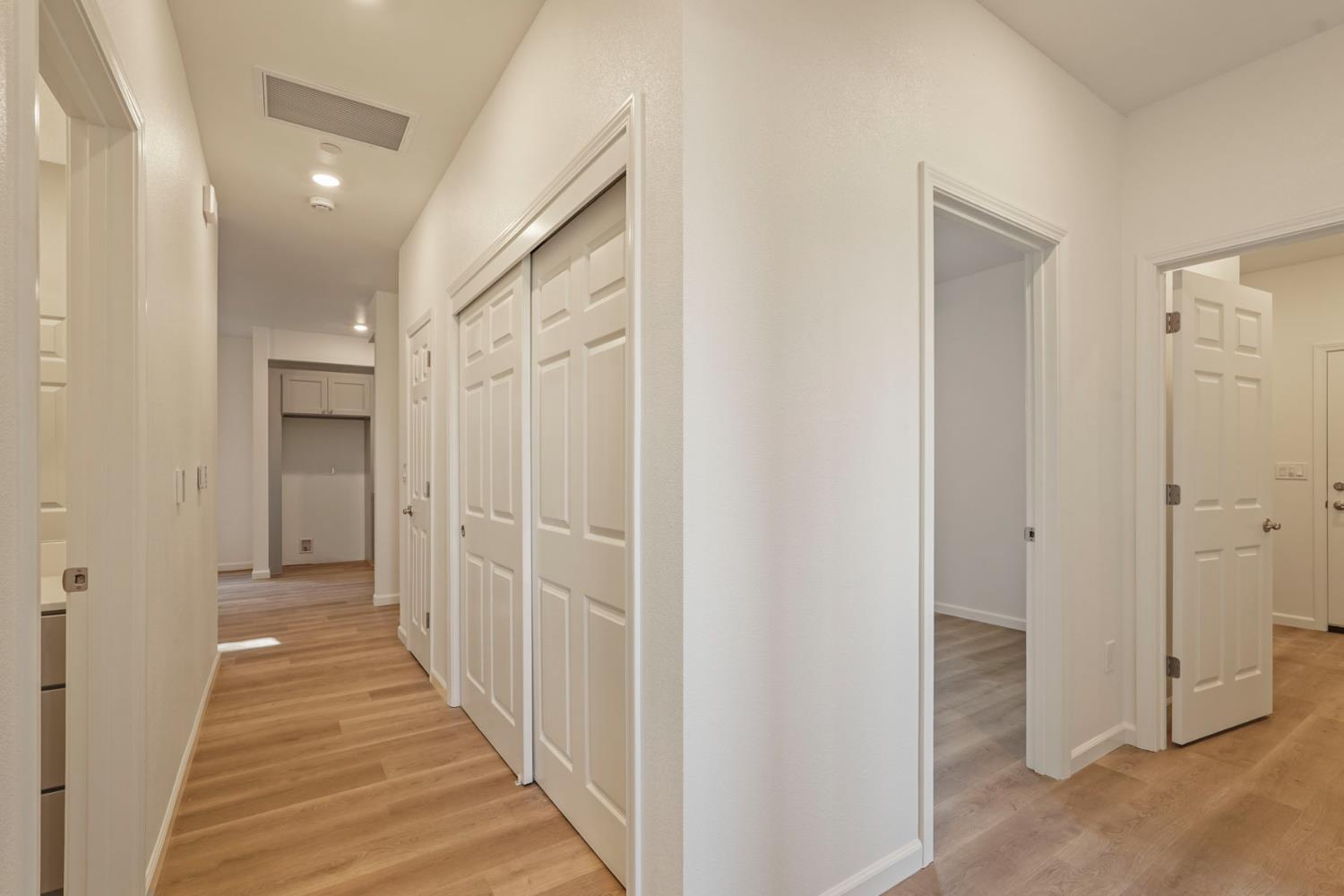 3286 Botfuher Road Valley Springs, CA 95252 - Photo 5 of 24 a view of a hallway with wooden shelves