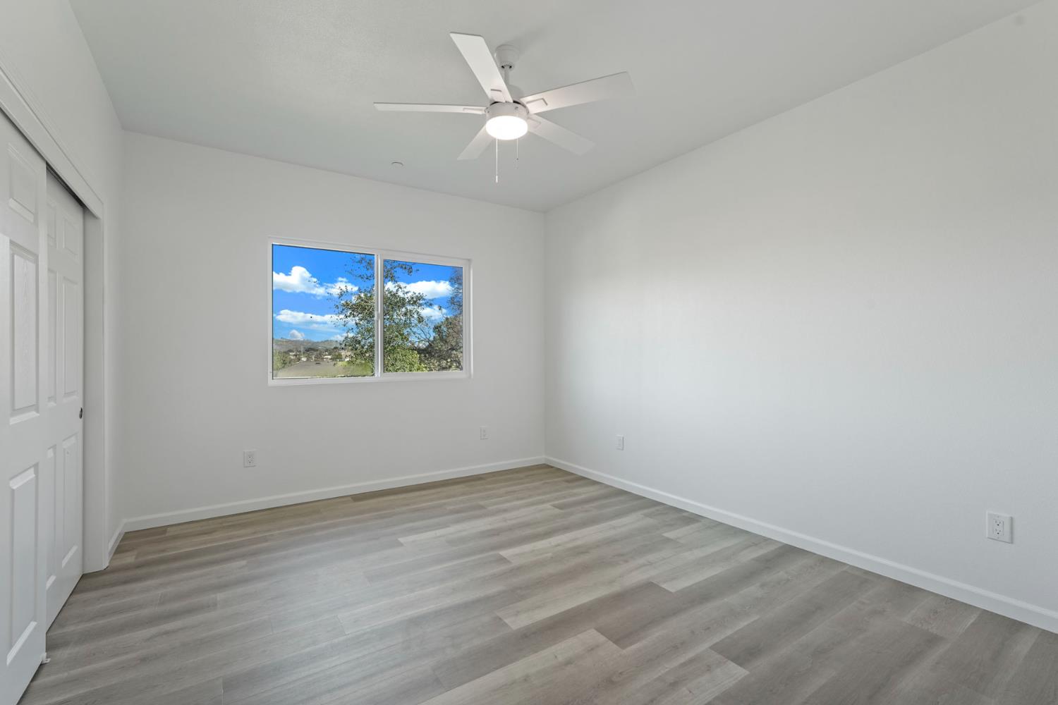 3286 Botfuher Road Valley Springs, CA 95252 - Photo 8 of 24 wooden floor in an empty room with a window