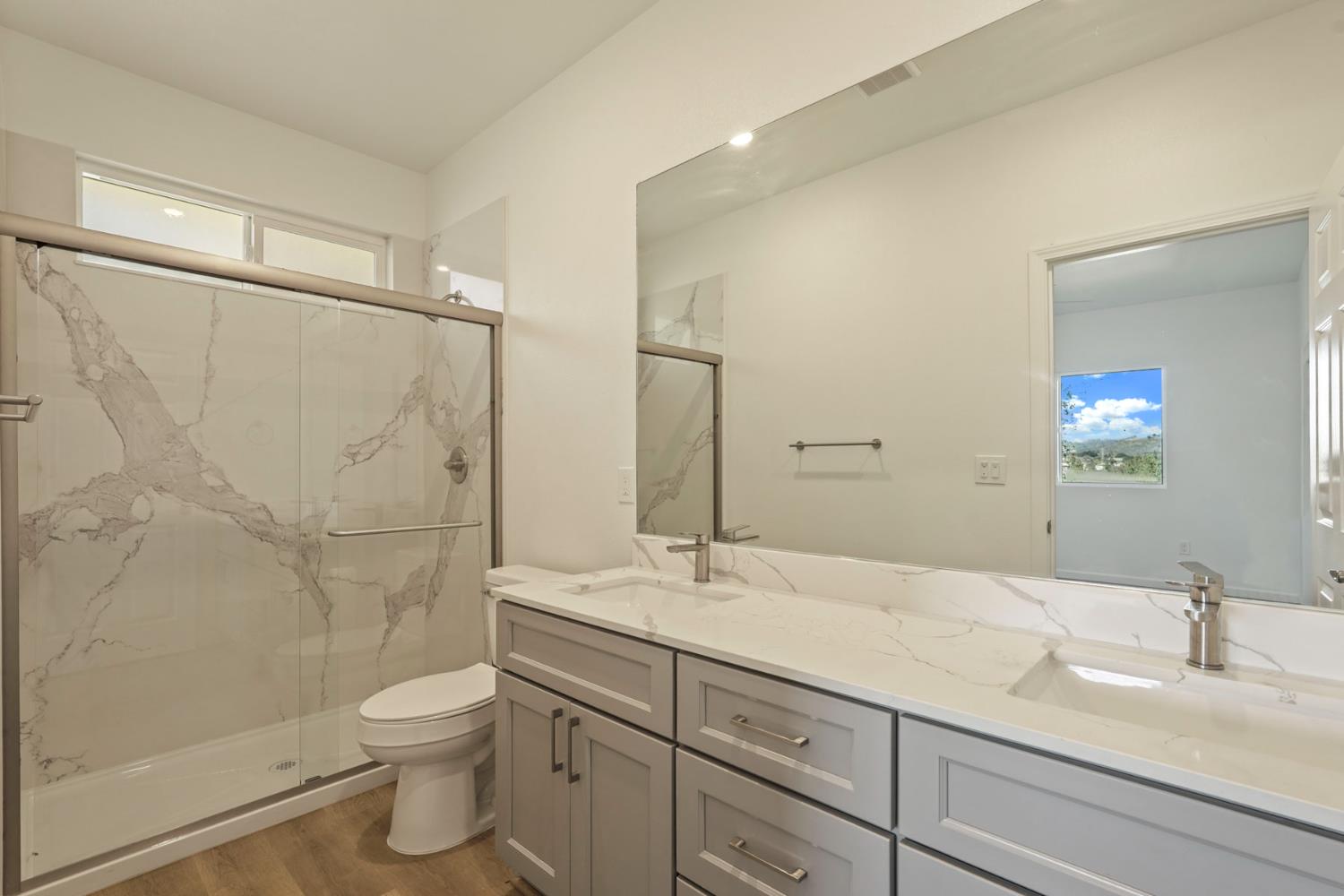 3286 Botfuher Road Valley Springs, CA 95252 - Photo 10 of 24 a bathroom with a granite countertop sink toilet and shower