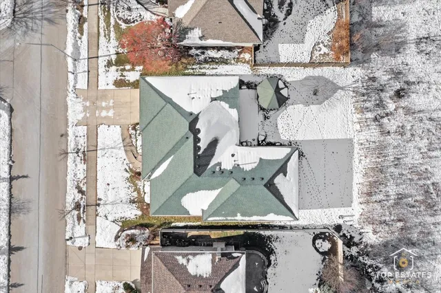 an aerial view of a kitchen with stainless steel appliances