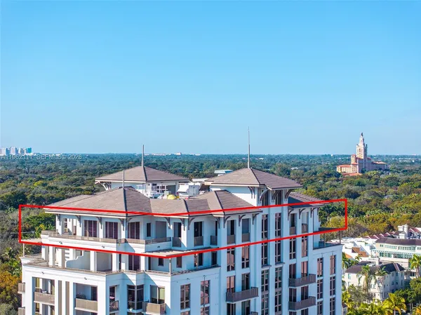 a view of buildings with a big yard