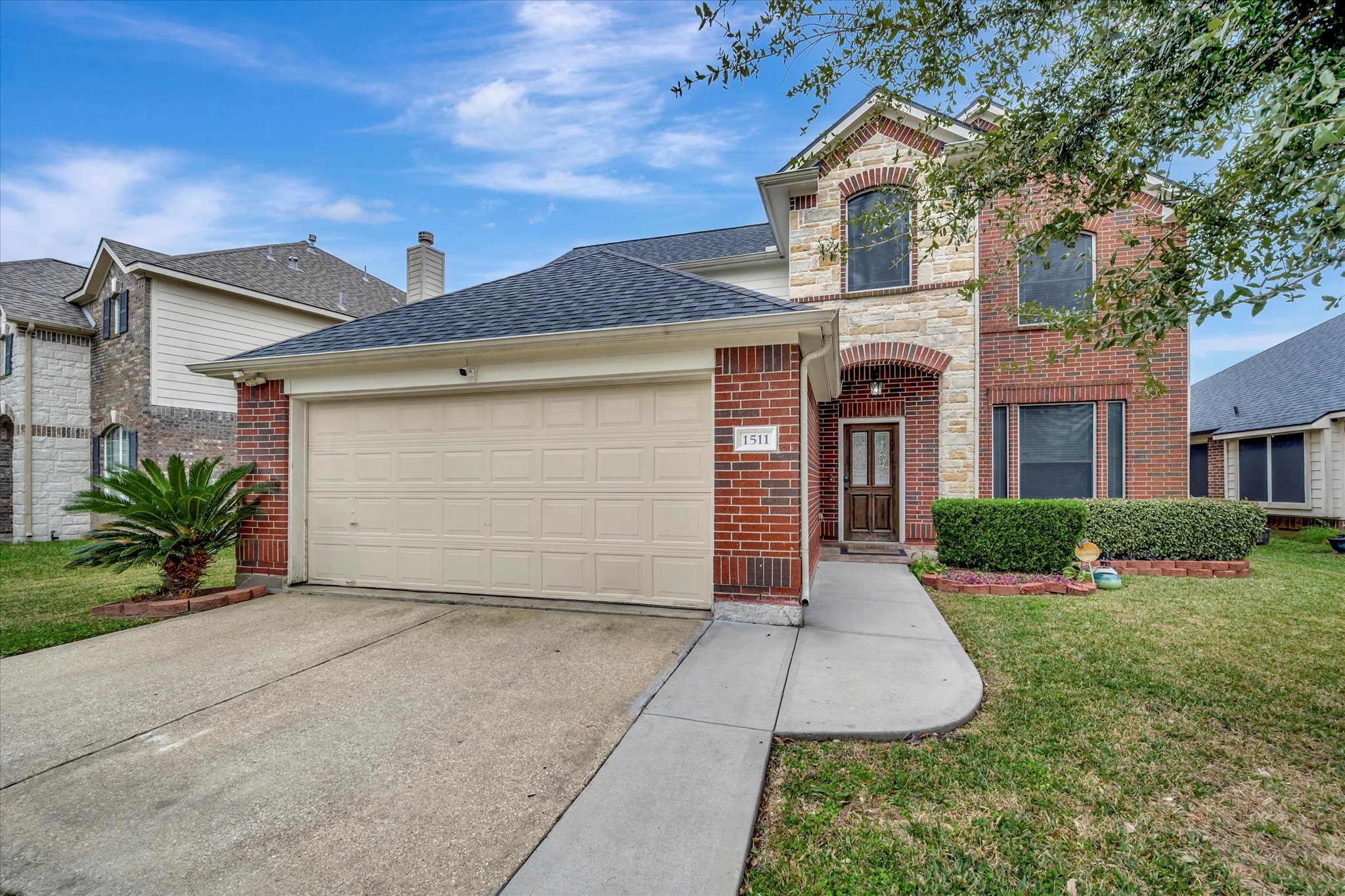 front view of a house with a yard