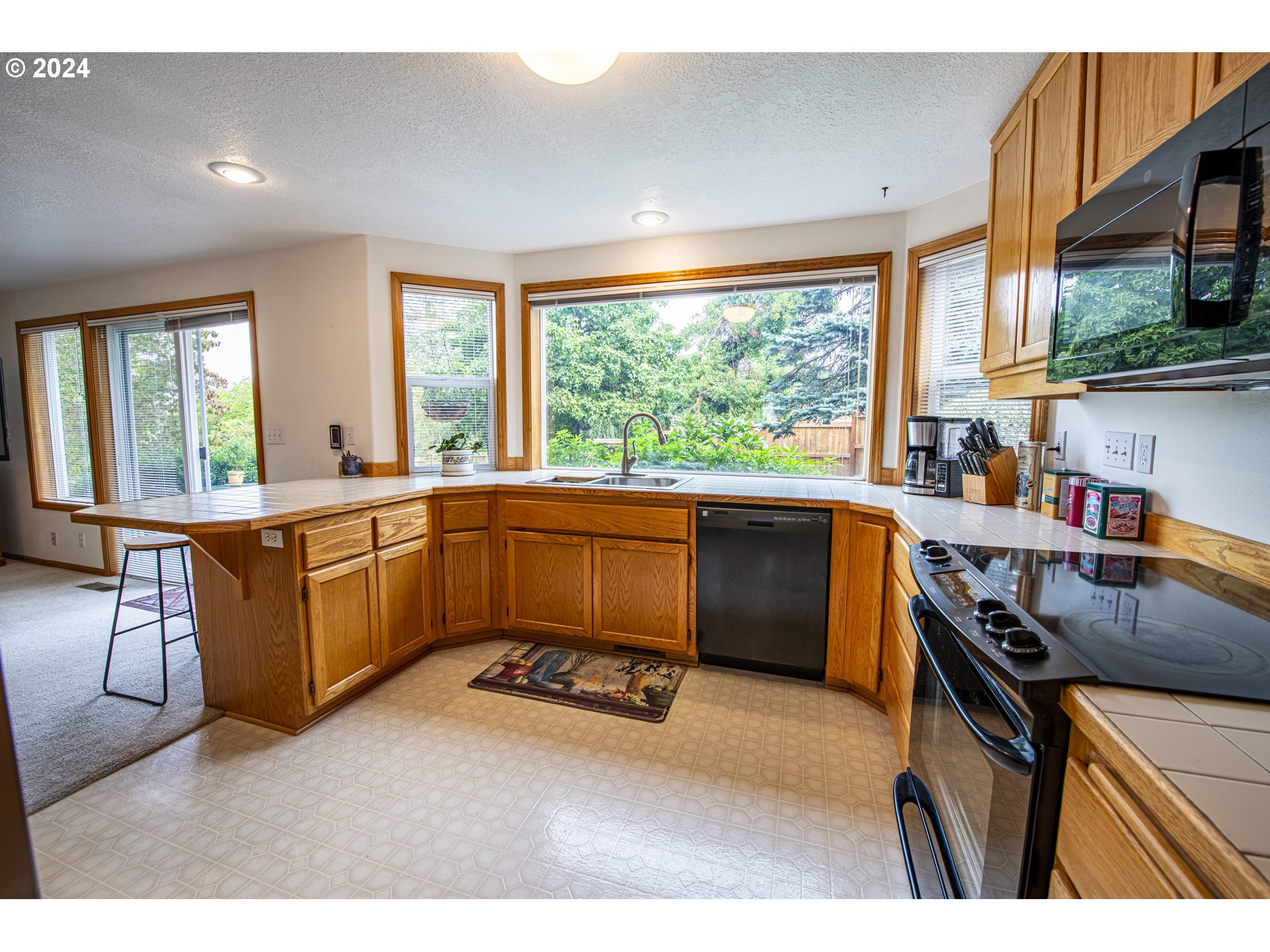 528 Granite Place Springfield, OR 97477 - Photo 13 of 38 a kitchen with a sink stove top oven and cabinets