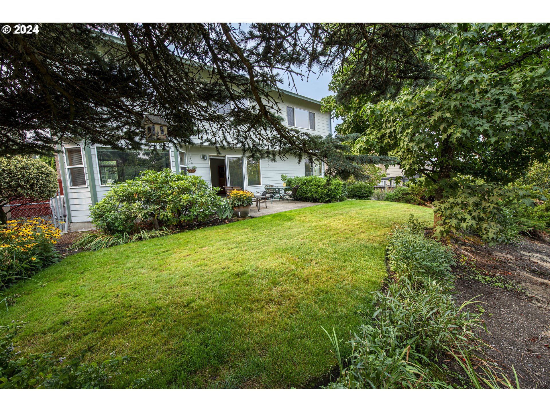 528 Granite Place Springfield, OR 97477 - Photo 35 of 38 a view of a house with a garden