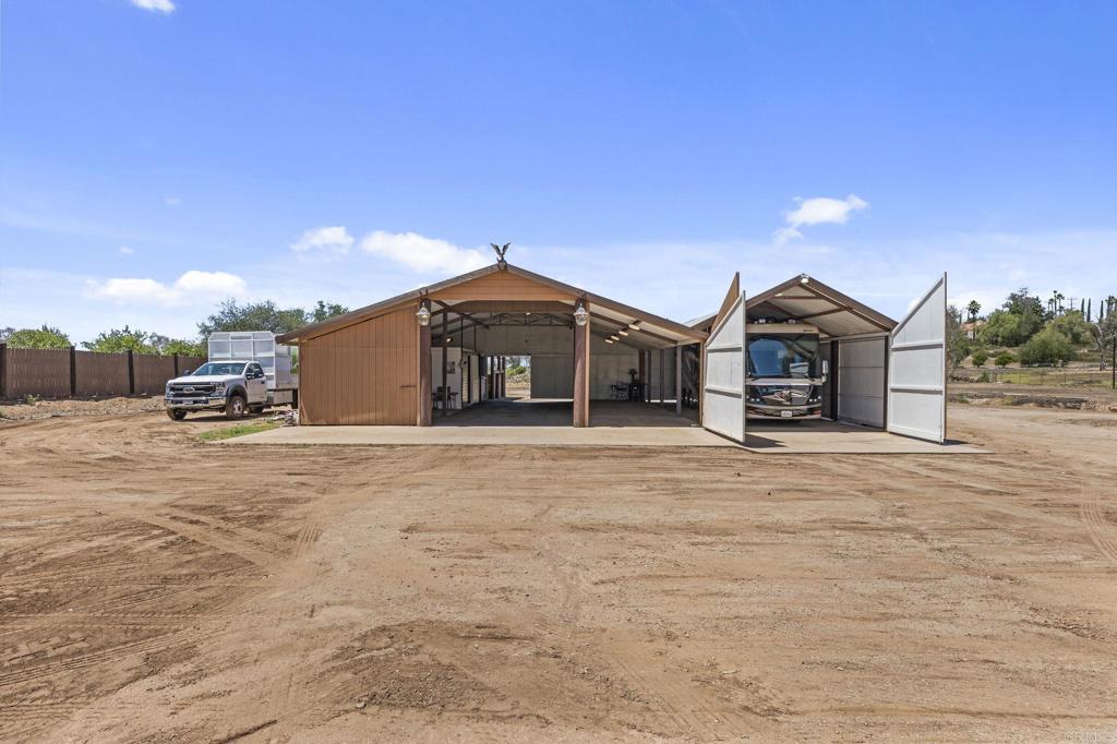 30265 Miller Road Valley Center, CA 92082 - Photo 36 of 56 a front view of a house with a yard and parking