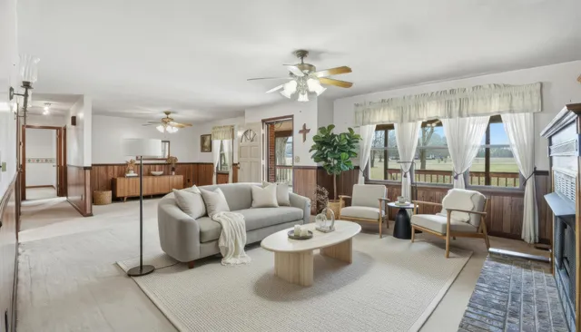 en empty room with ceiling fan and window