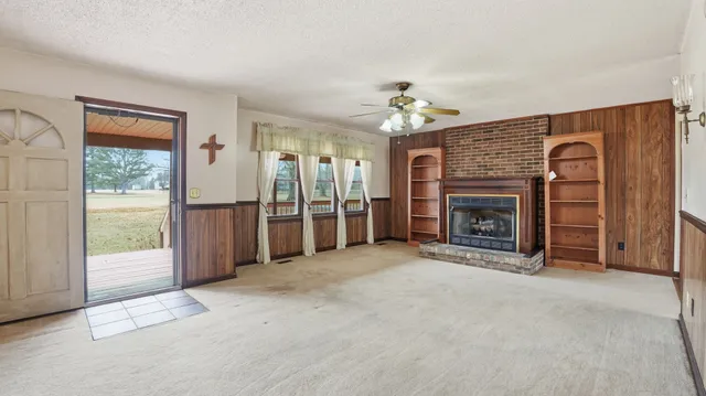 a view of a kitchen with a refrigerator and a sink