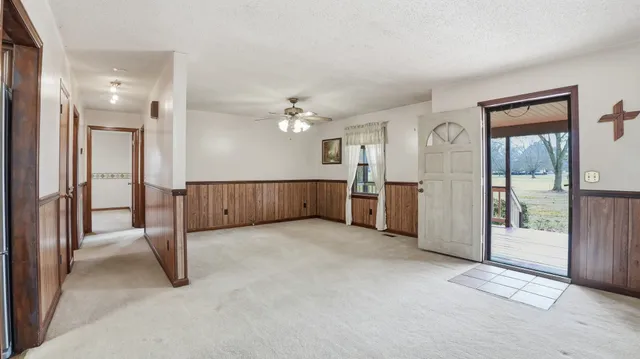 a kitchen with stainless steel appliances a refrigerator sink and microwave