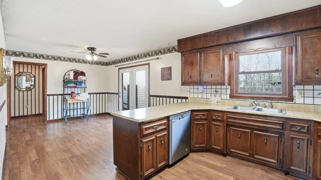 a kitchen with stainless steel appliances granite countertop a stove and a sink