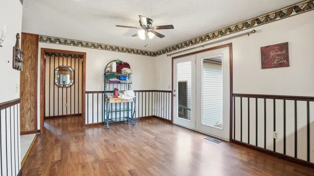 a kitchen with stainless steel appliances granite countertop a refrigerator a sink and a stove