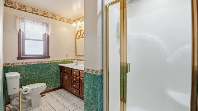 a view of a hallway with closet and front door