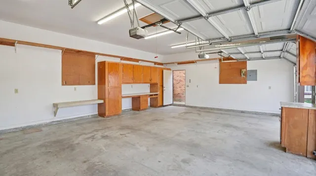 a front view of a building with a garden