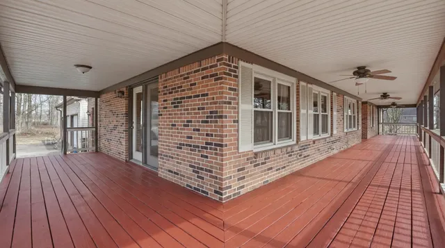 a view of a balcony with wooden floor