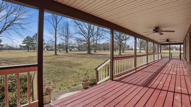 a view of a balcony with wooden floor