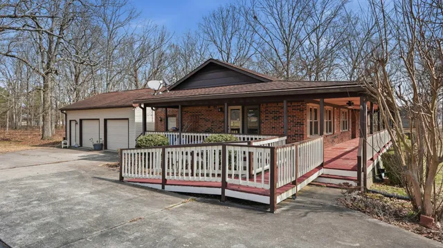 a view of an empty room with a fireplace