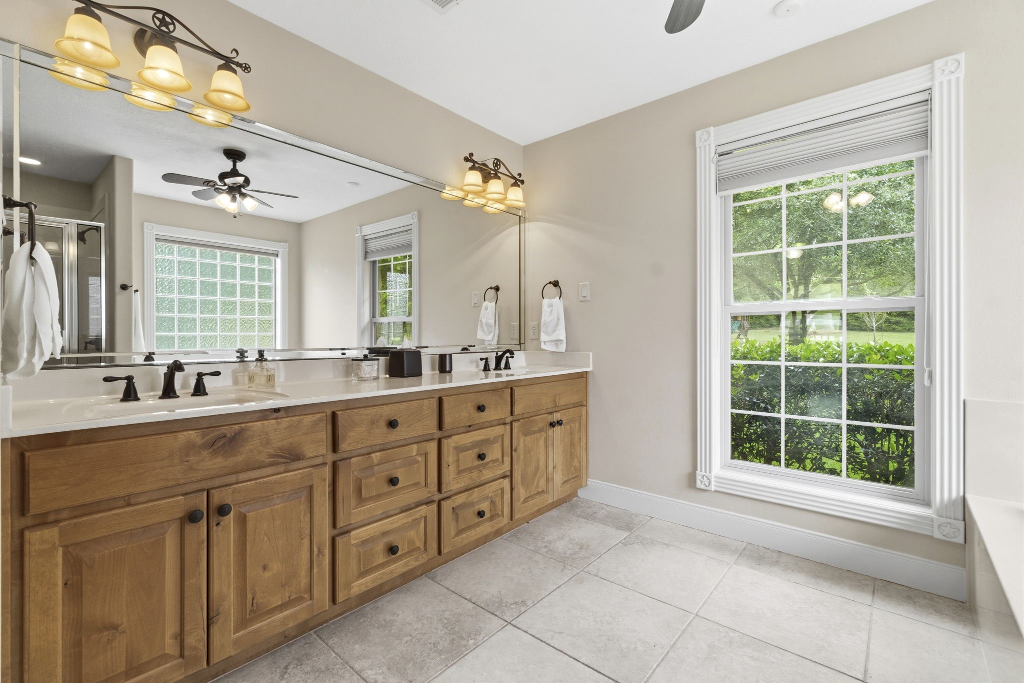 259 Memphis Bell Lane Trinity, TX 75862 - Photo 17 of 50 a spacious bathroom with a granite countertop sink mirror and a bathtub
