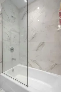 a bedroom with a bed and a chair