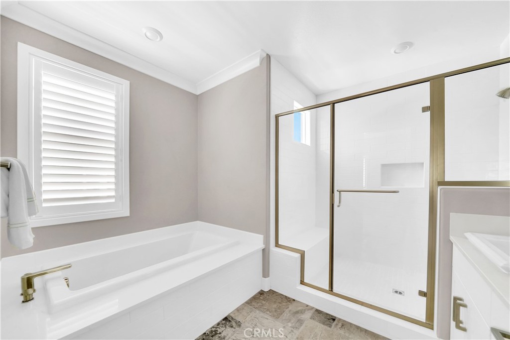 249 Chorus Irvine, CA 92618 - Photo 12 of 32 a spacious bathroom with a bathtub and a shower