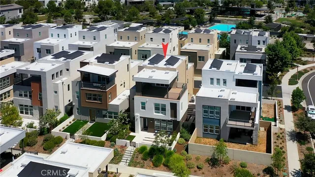 a picture of street with lots of residential buildings