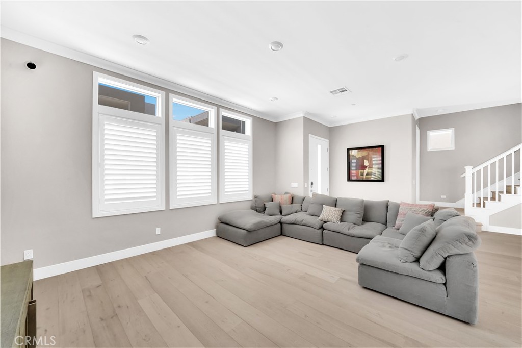 249 Chorus Irvine, CA 92618 - Photo 5 of 32 a living room with furniture and a large window