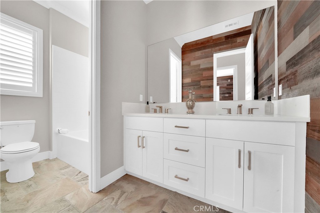 249 Chorus Irvine, CA 92618 - Photo 10 of 32 a bathroom with a sink toilet and mirror