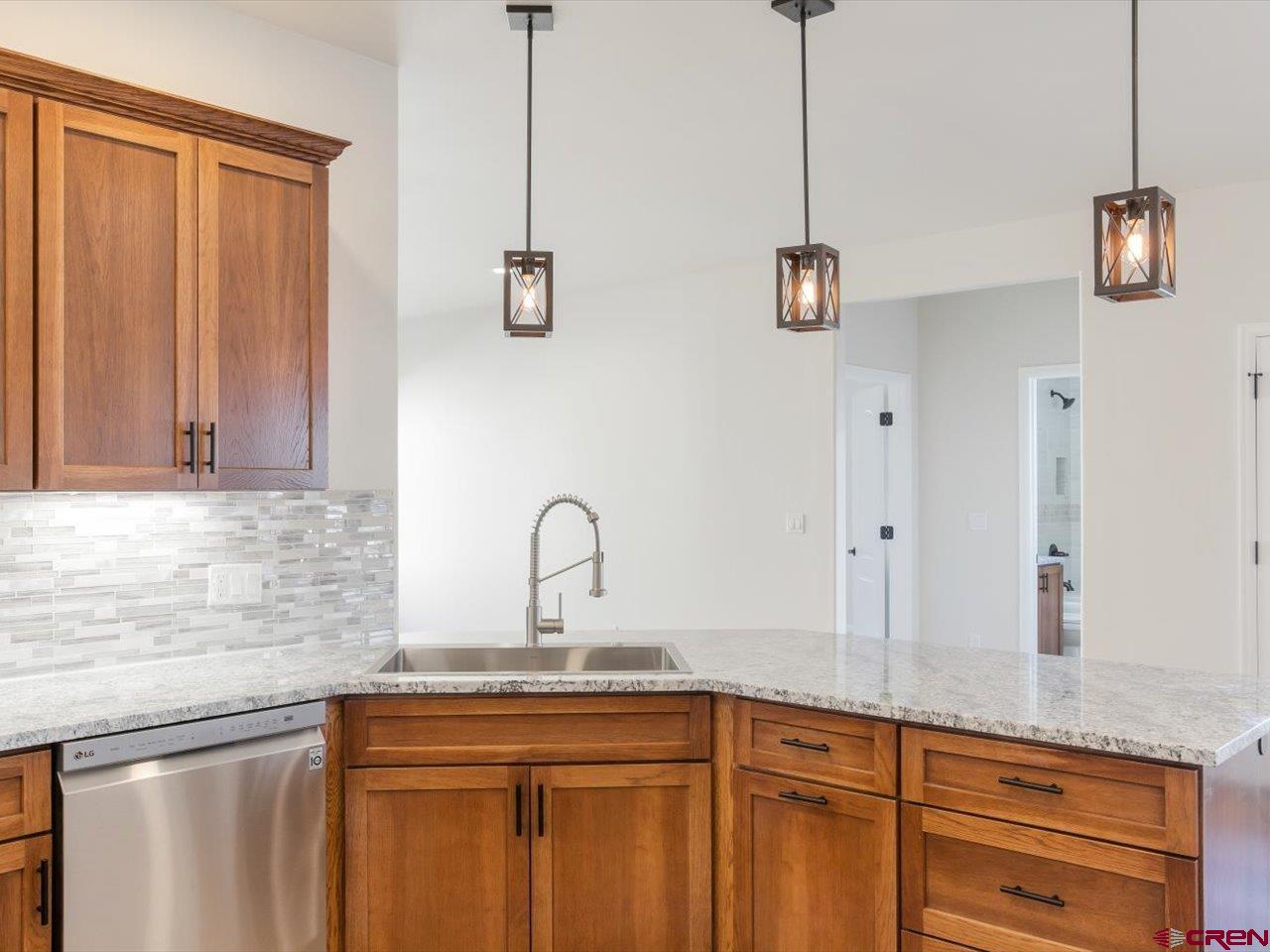 3415 Chestnut Drive Montrose, CO 81401 - Photo 12 of 28 a kitchen with a sink and cabinets