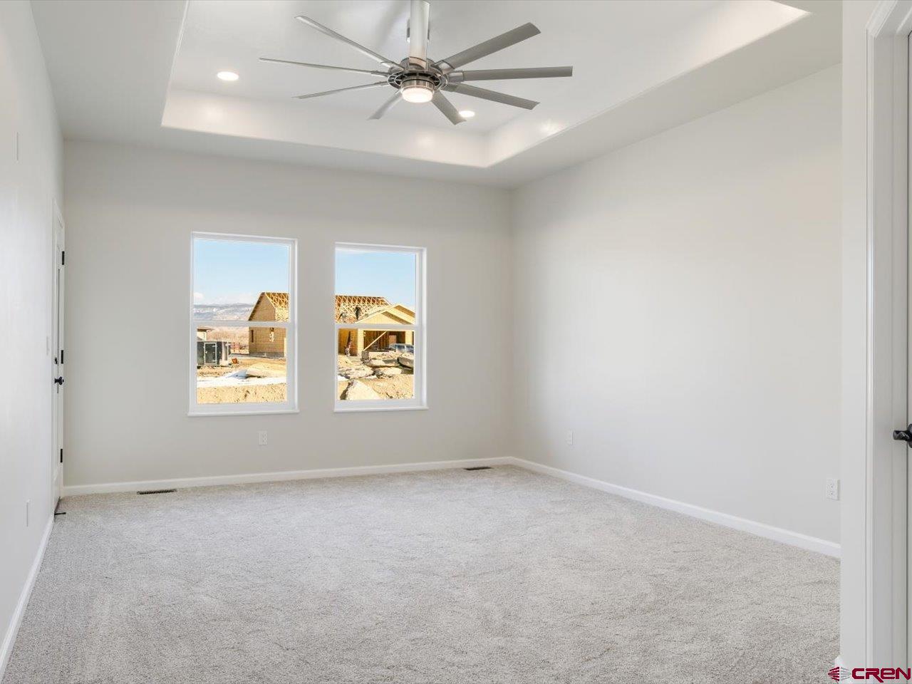 3415 Chestnut Drive Montrose, CO 81401 - Photo 16 of 28 an empty room with a window and a fan