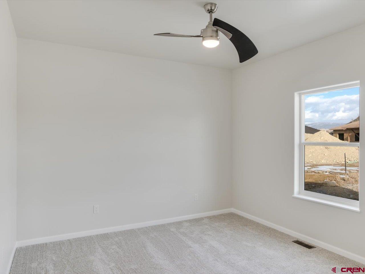 3415 Chestnut Drive Montrose, CO 81401 - Photo 22 of 28 a view of an empty room with a window