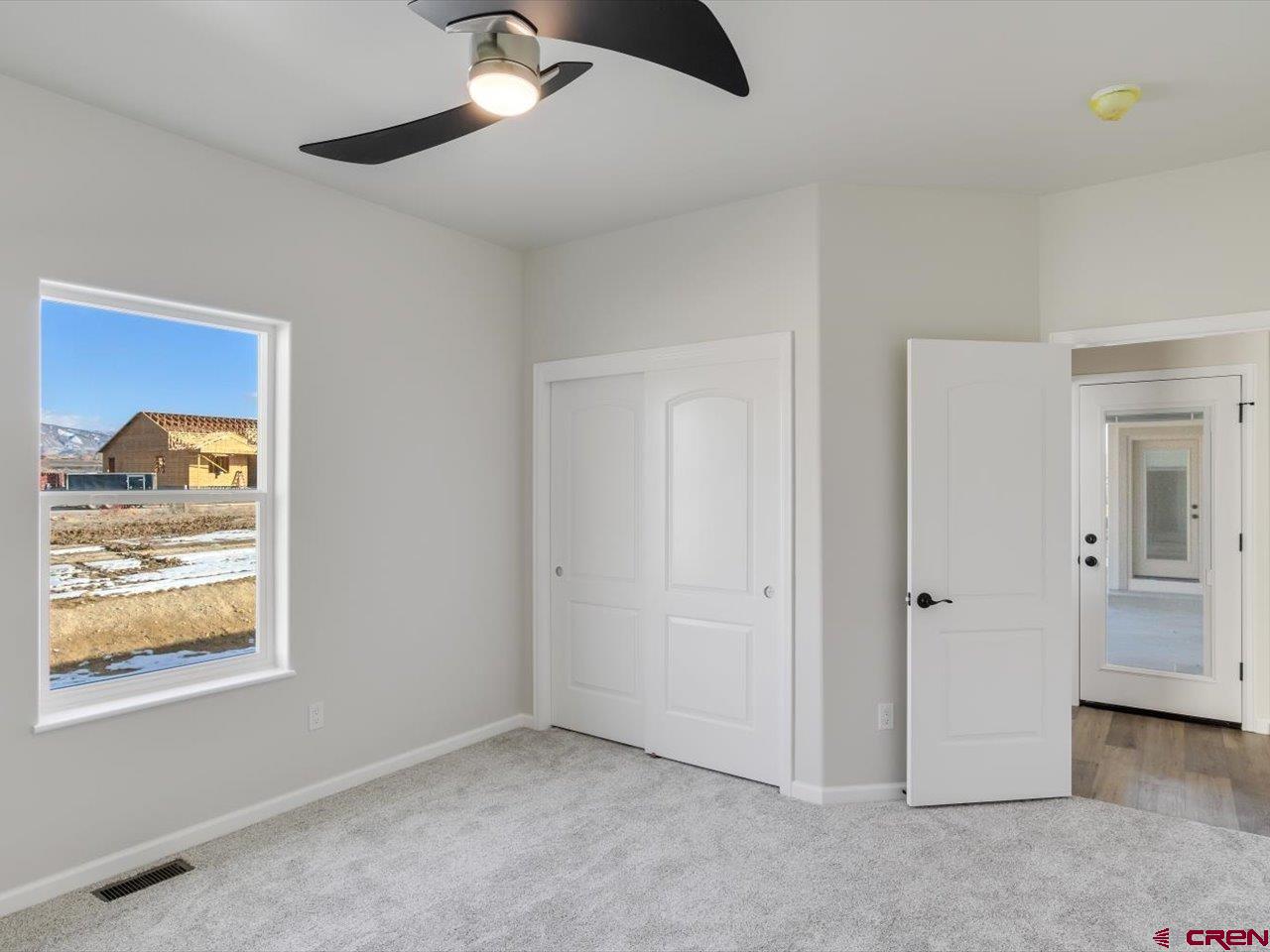 3415 Chestnut Drive Montrose, CO 81401 - Photo 23 of 28 a view of an empty room with window and cabinet