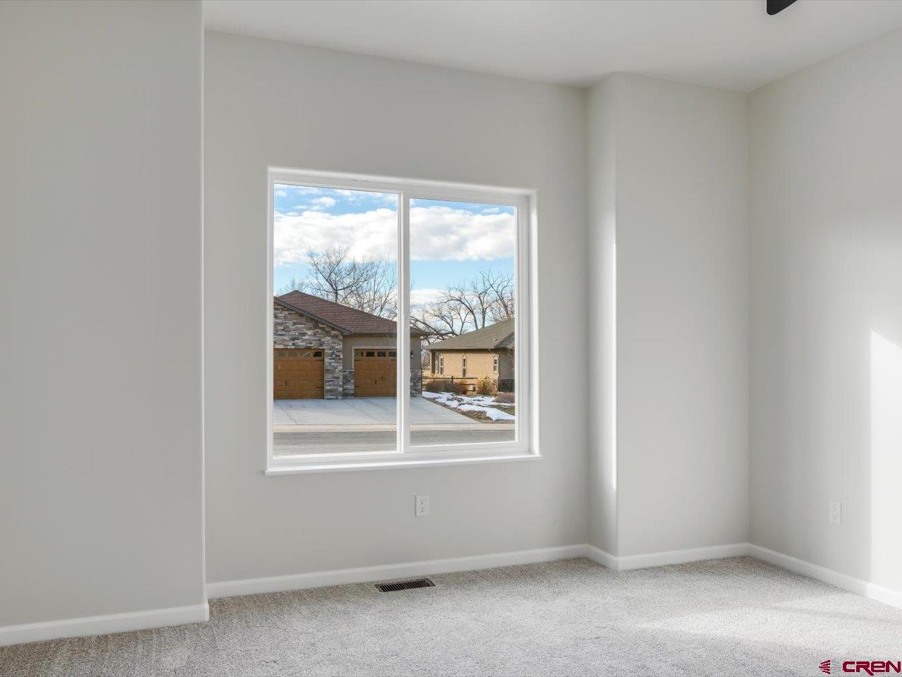 3415 Chestnut Drive Montrose, CO 81401 - Photo 25 of 28 a view of an empty room with a window