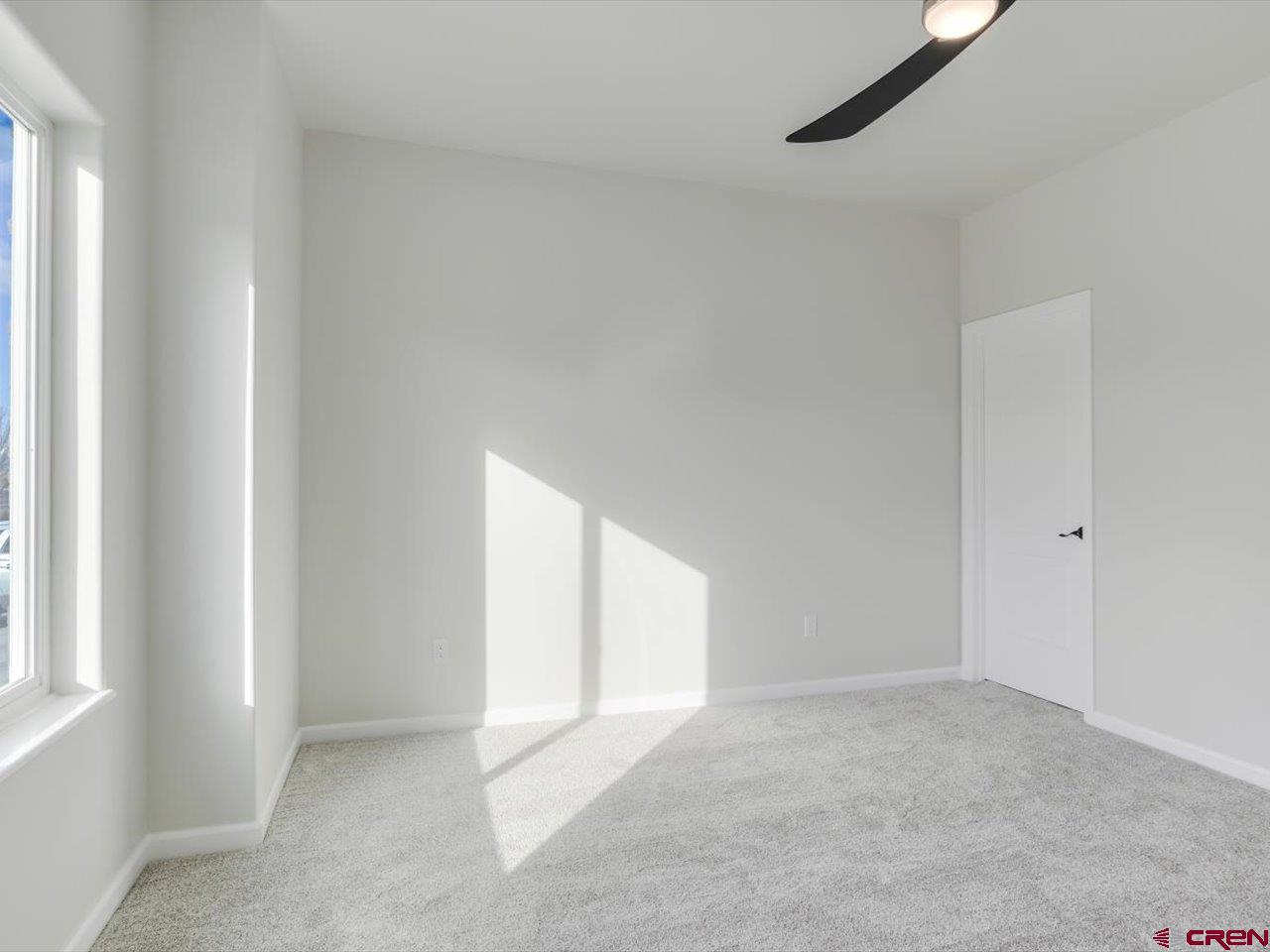 3415 Chestnut Drive Montrose, CO 81401 - Photo 26 of 28 a view of an empty room with a window