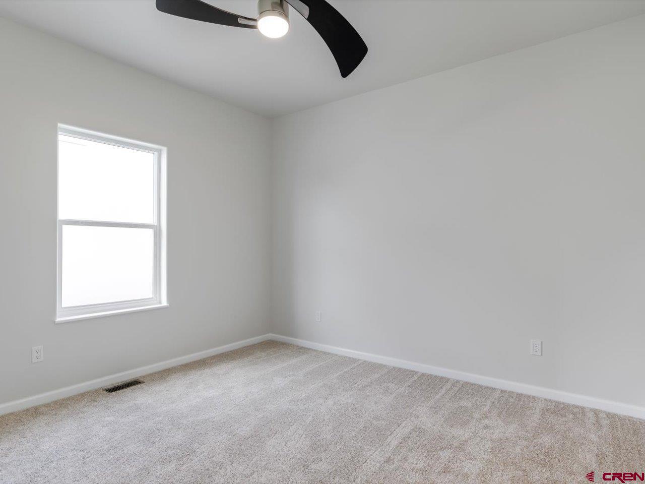 3415 Chestnut Drive Montrose, CO 81401 - Photo 27 of 28 an empty room with a window