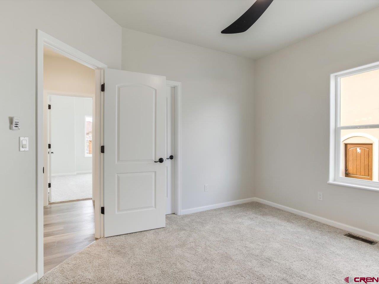 3415 Chestnut Drive Montrose, CO 81401 - Photo 28 of 28 an empty room with windows and closet