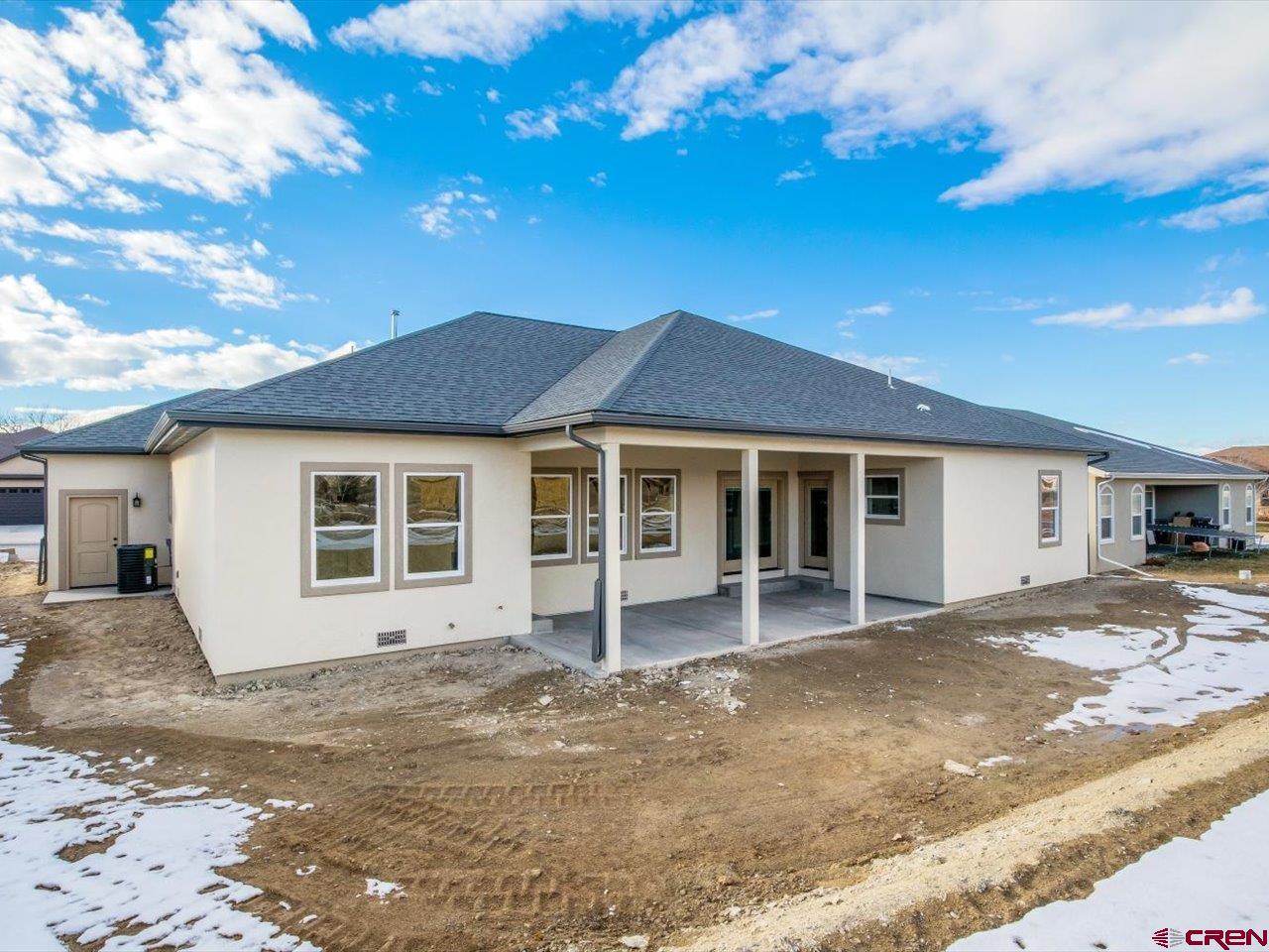 3415 Chestnut Drive Montrose, CO 81401 - Photo 3 of 28 a front view of a house with a garage