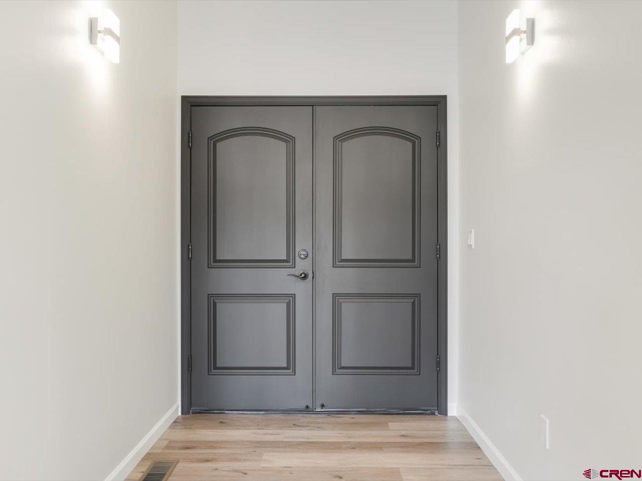 3415 Chestnut Drive Montrose, CO 81401 - Photo 5 of 28 a view of front door with wooden floor