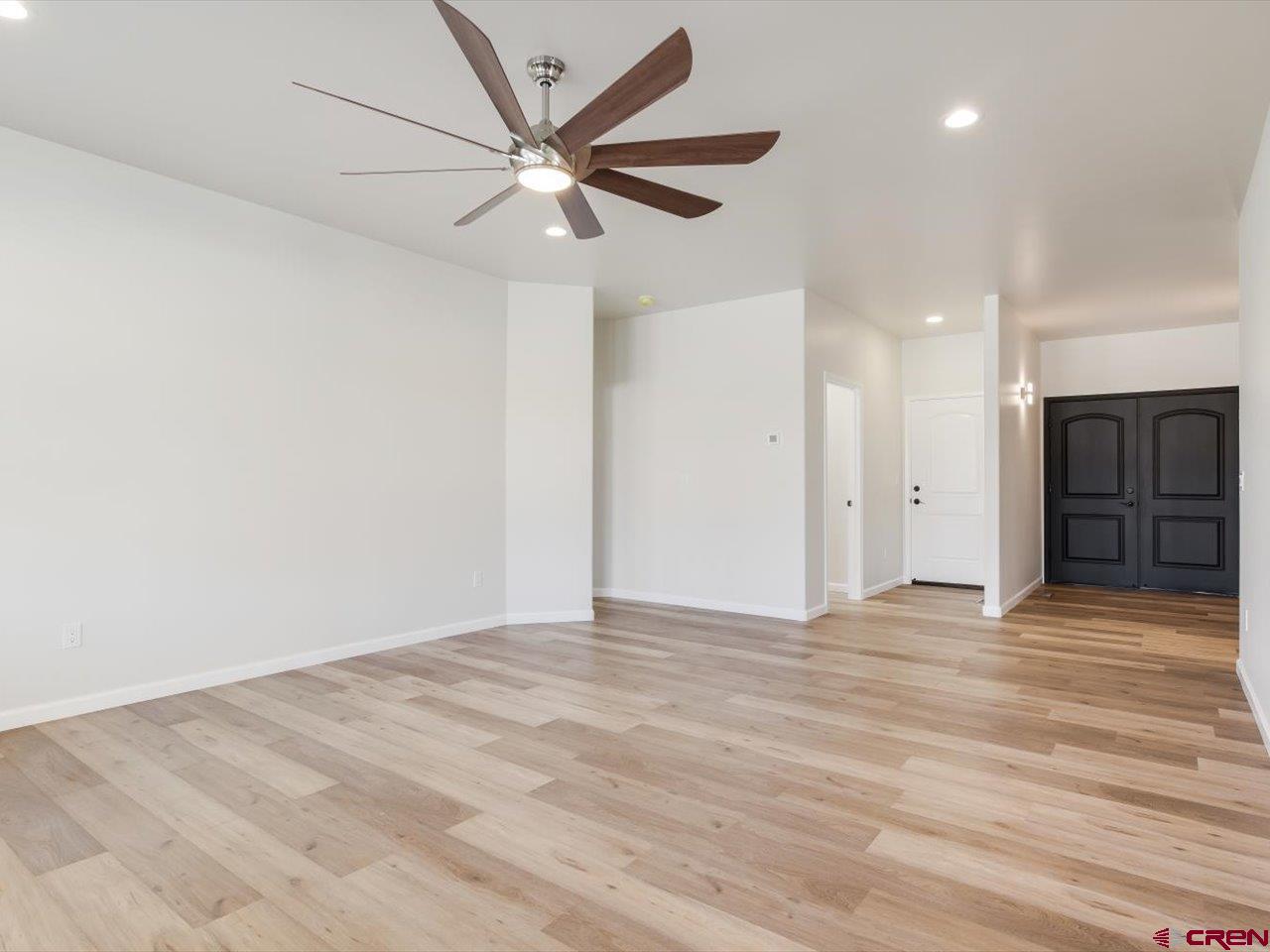 3415 Chestnut Drive Montrose, CO 81401 - Photo 6 of 28 an empty room with fan and a ceiling fan