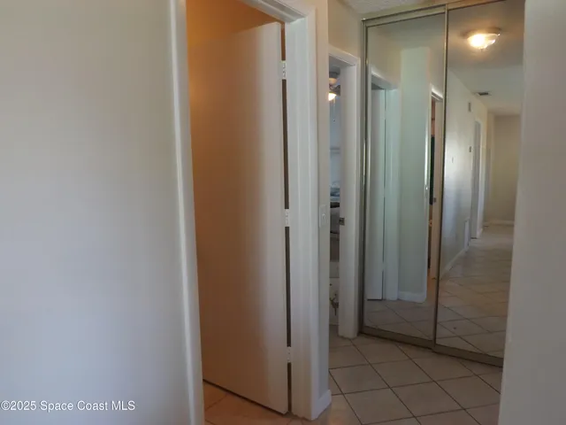 a bathroom with a shower and closet