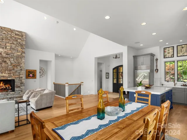 a view of a chairs and a fireplace in a big room