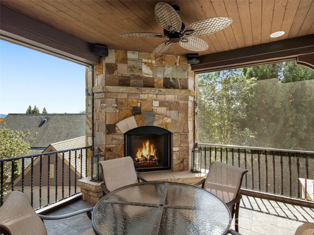 a view of a deck with wooden floor and outdoor seating
