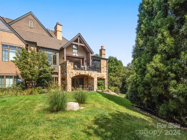 a view of a house with a yard and garage