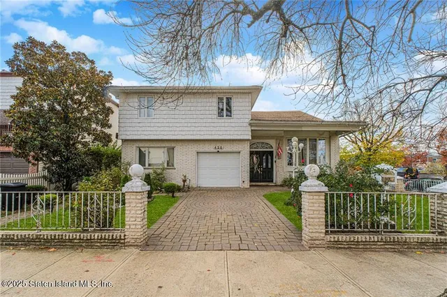 front view of a house with a small yard