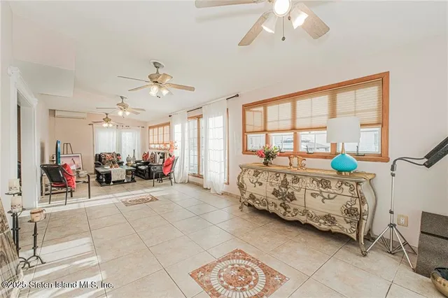 a bed room with furniture and a window