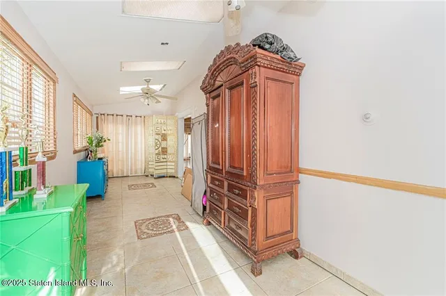 a view of hallway with stairs and furniture