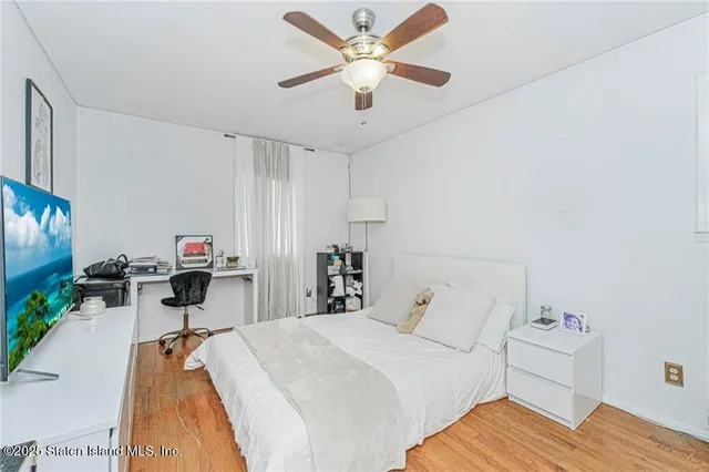 a bed room with a bed and a chandelier