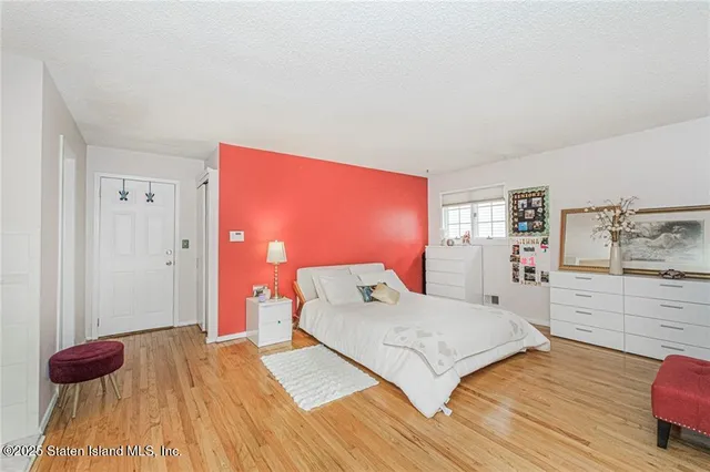 a bedroom with a bed and a walk in closet